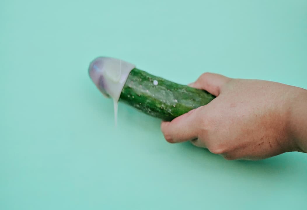 Cucumber with cream on the tip to resemble penis discharge